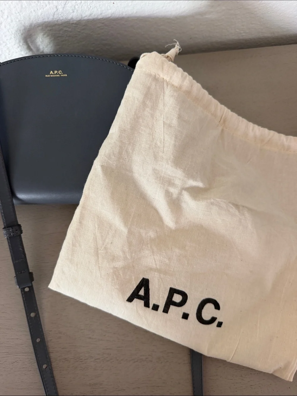 A.P.C. Half-Moon Leather Crossbody Bag in Black with Gold Logo
